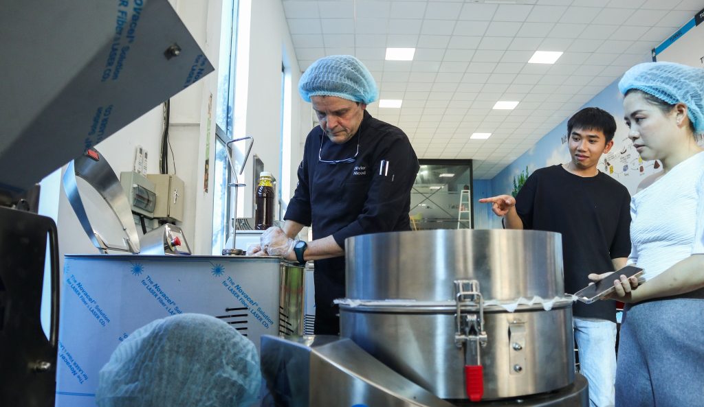 Operators manage Chocolate Production Equipment in the workshop, ensuring optimal efficiency and chocolate product quality.
